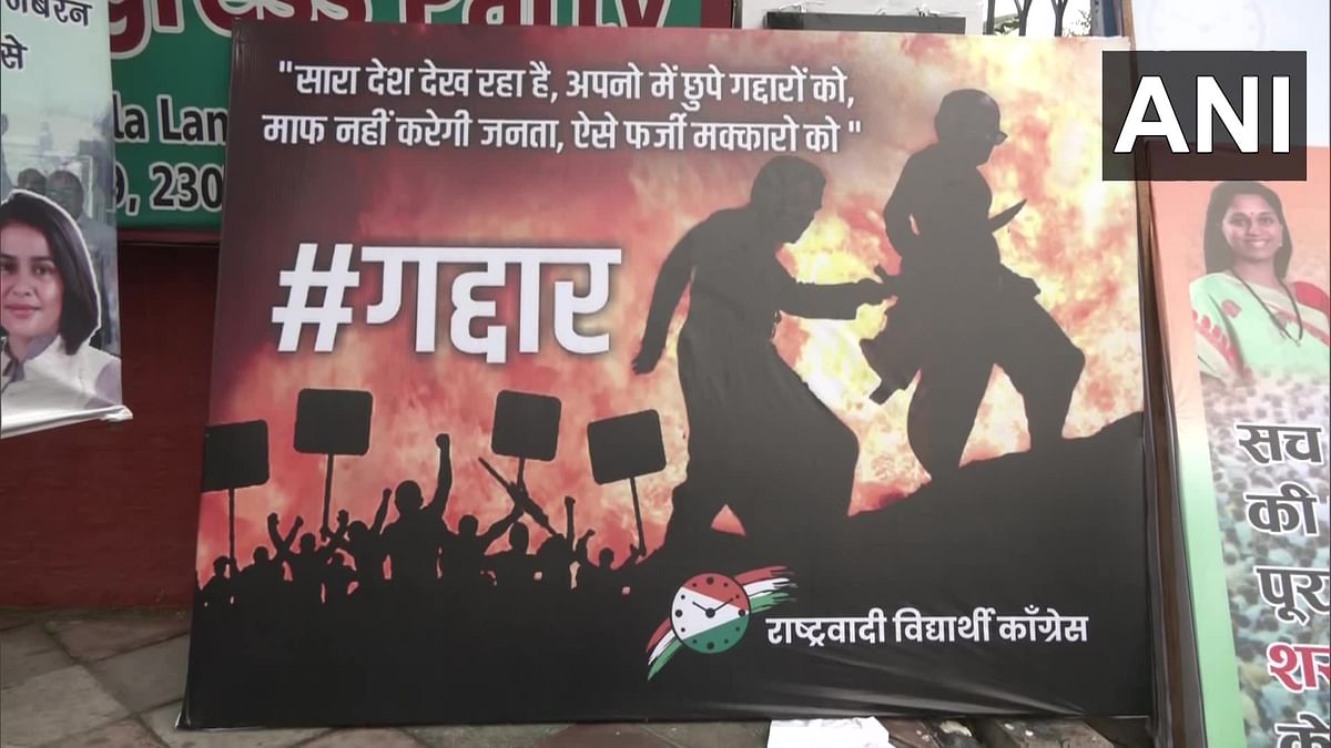 traitor!  Posters in support of Sharad Pawar in Delhi show 'Katappa' stabbing 'Bahubali' in the back