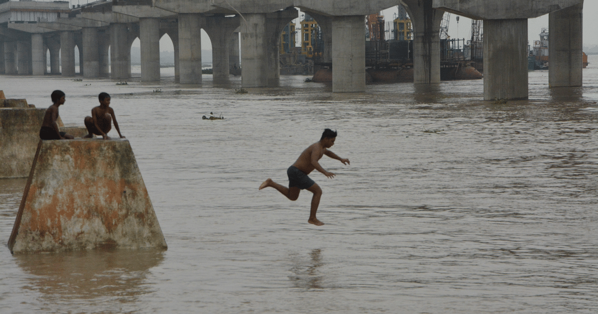 In the capital Patna, children risking their lives to take a dip in Ganga spate, see photos